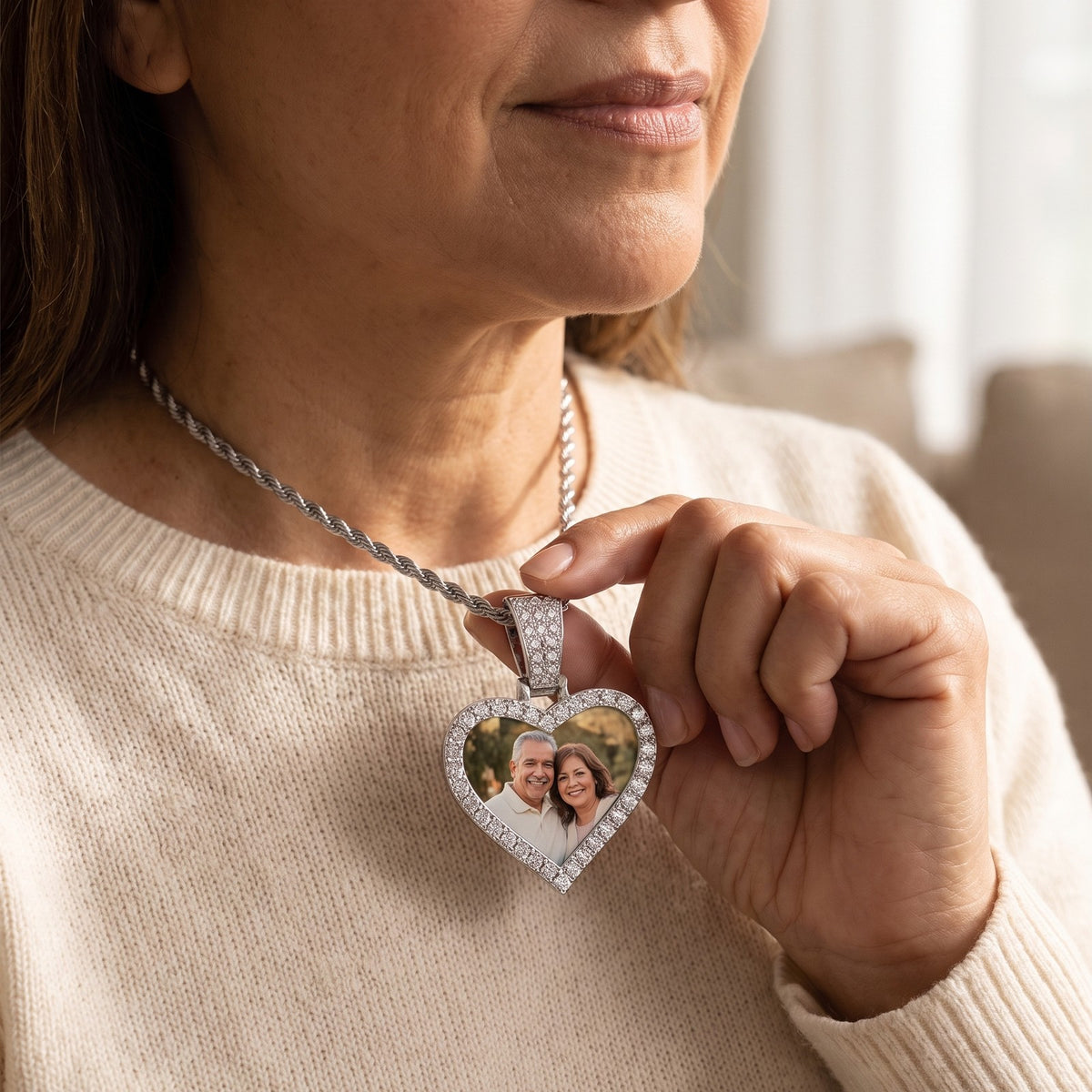The Memory Pendant worn on a silver rope chain